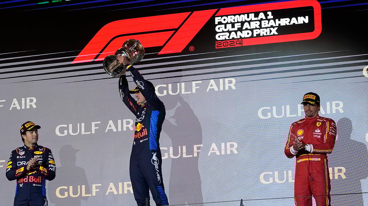 Darko Bandic : First place, Red Bull driver Max Verstappen of the Netherlands, center, holds his trophy as he stands on the podium with second place, Red Bull driver Sergio Perez of Mexico, left, and third place, Ferrari driver Carlos Sainz of Spain during the Formula One Bahrain Grand Prix at the Bahrain International Circuit in Sakhir, Bahrain, Saturday, March 2, 2024.