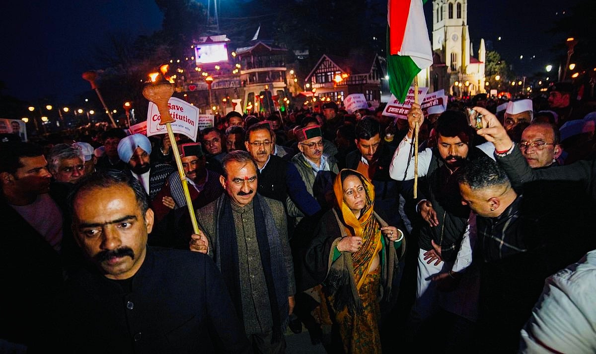 Himachal Pradesh Chief Minister Sukhvinder Singh Sukhu with Himachal Pradesh Congress President Pratibha Singh takes part in a protest march against the Central Government, in Shimla - PTI