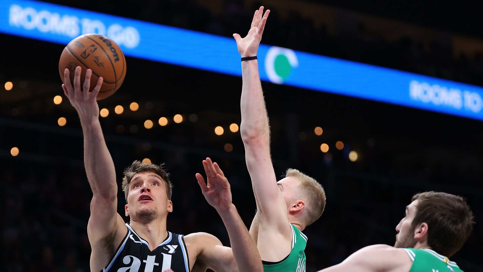 Atlanta Hawks guard Bogdan Bogdanovic attempts a shot vs. the Boston Celtics on March 25, 2024. - null