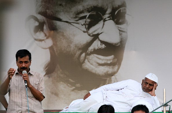NEW DELHI, INDIA -AUGUST 19: Team Anna memeber Arvind Kejriwal speaks also seen Veteran Indian social activist Anna Hazare at Ramlila Maidan in New Delhi on Friday.  - (Photo by K Asif/The India Today Group via Getty Images)