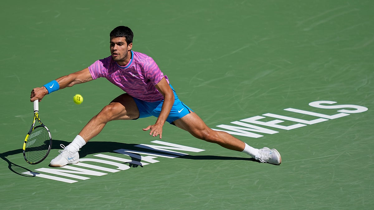 AP : Carlos Alcaraz of Spain hits a return to Fabian Marozsan of Hungary during their match at the BNP Paribas Open in Indian Wells, Calif. on March 12, 2024.
