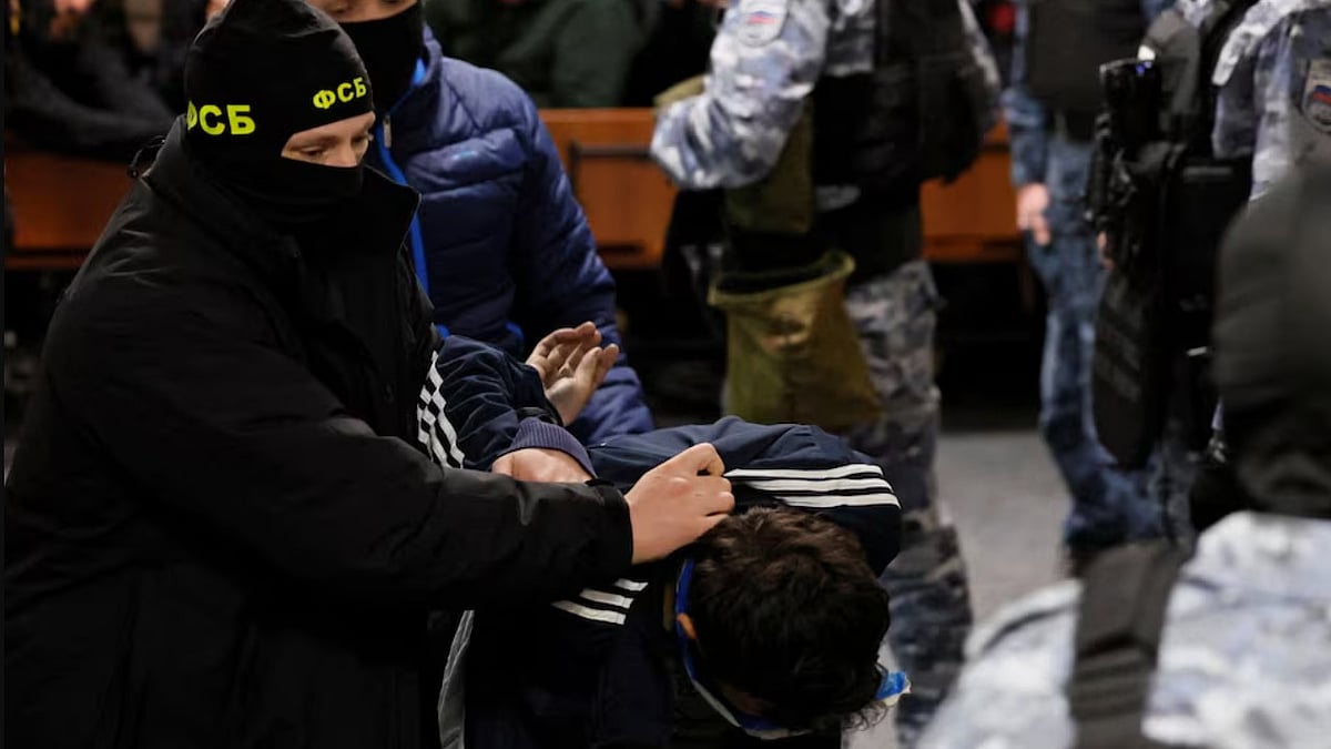 AP : A suspect in the shooting attack at the Crocus City Hall concert venue is escorted inside the Basmanny district court in Moscow. 