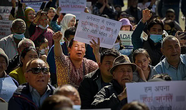 Getty Images : Residents from Ladakh hold placards demanding statehood for their region during a protest at Jantar Mantar, Delhi. 
