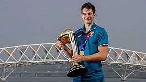 File : Pat Cummins with the ICC Cricket World Cup 2023 trophy at the Sabarmati riverfront in Gujarat.