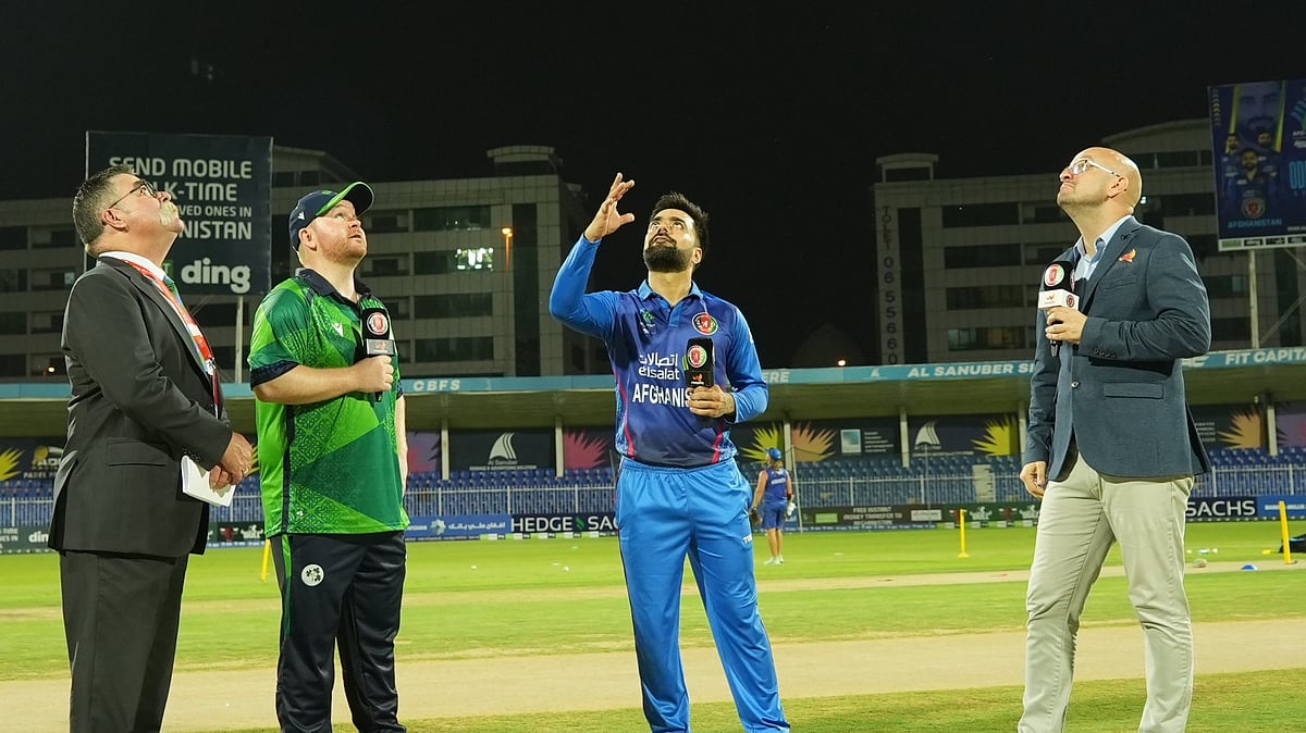 (Photo: X|Afghanistan Cricket Board) : Afghanistan captain Rashid Khan (second from right) and Ireland captain Paul Stirling (third from right) at the toss for the 2nd T20I match on March 17, Sunday. 