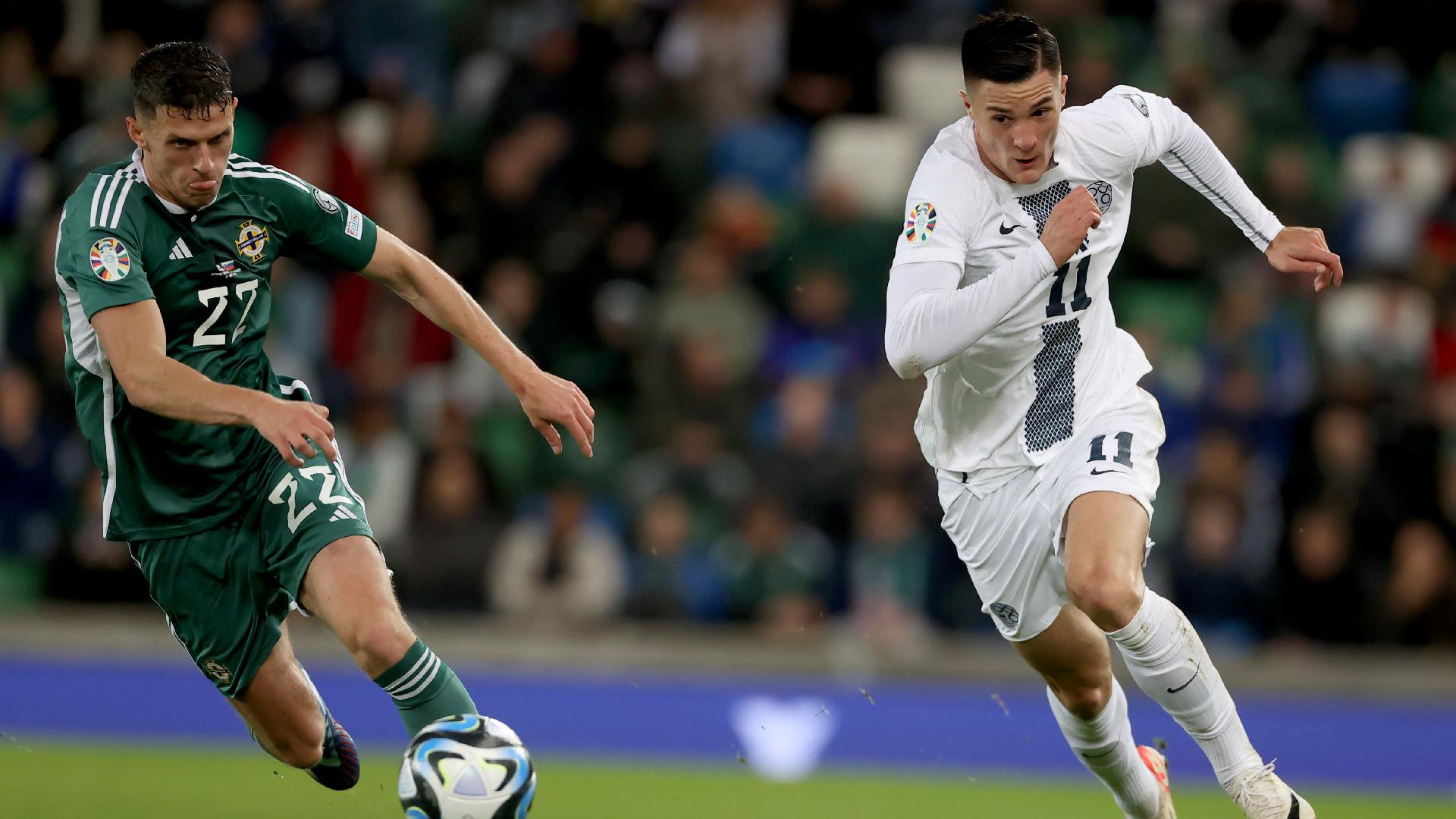 Northern Ireland’s Eoin Toal battles with Slovenia’s Benjamin Sesko, right. -  PA
