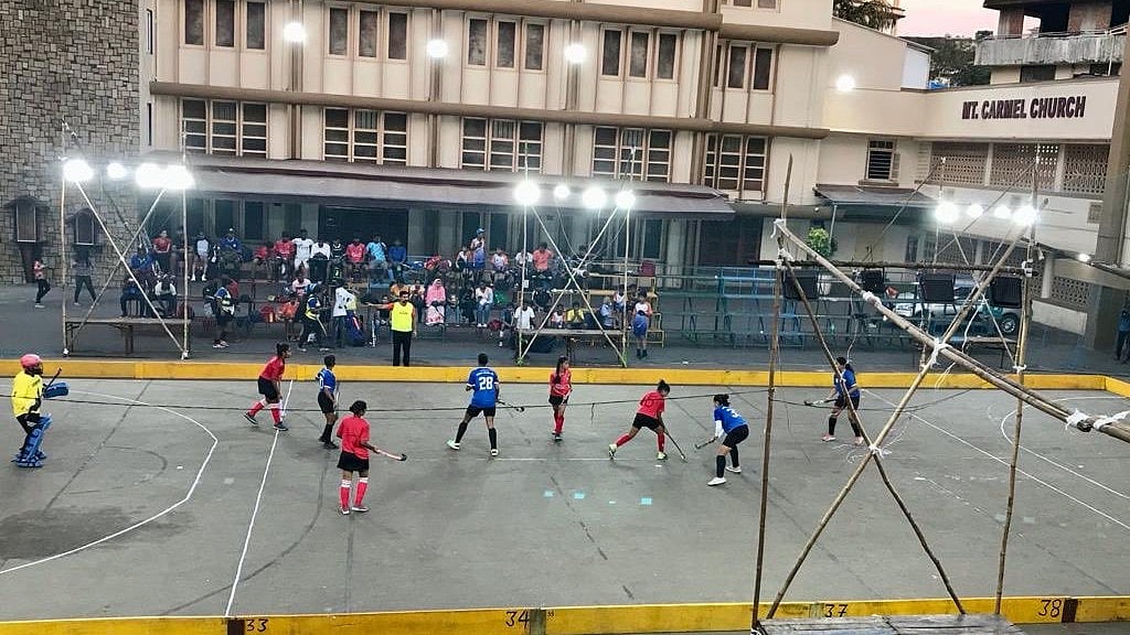 X (Viren Rasquinha) : Players in action during a Mt. Carmel Rink Hockey Tournament match in Bandra, 2022.