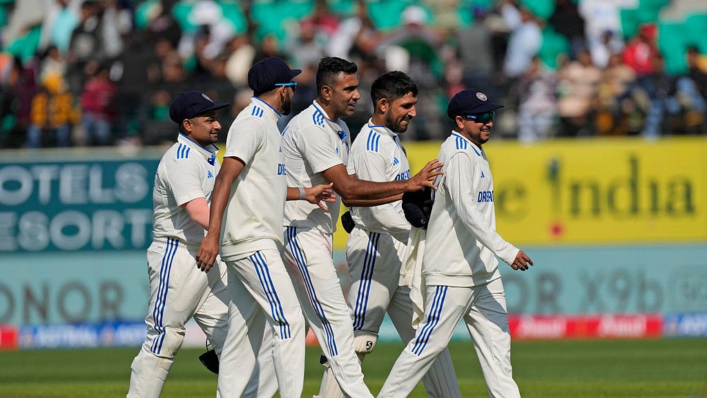AP/Ashwini Bhatia : India's Kuldeep Yadav, right, is playfully pushed by teammate Ravichandran Ashwin as they leave the field at the end of England's innings on the first day of their fifth and final Test match in Dharamsala.