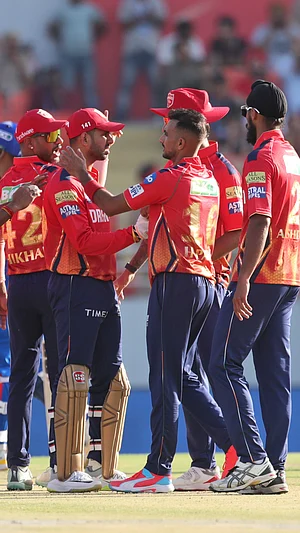 AP Photo/Pankaj Nangia : Punjab Kings' players celebrate the wicket of Delhi Capitals' Axar Patel during their Indian Premier League 2024 match in Mullanpur, Punjab on March 23, 2024.