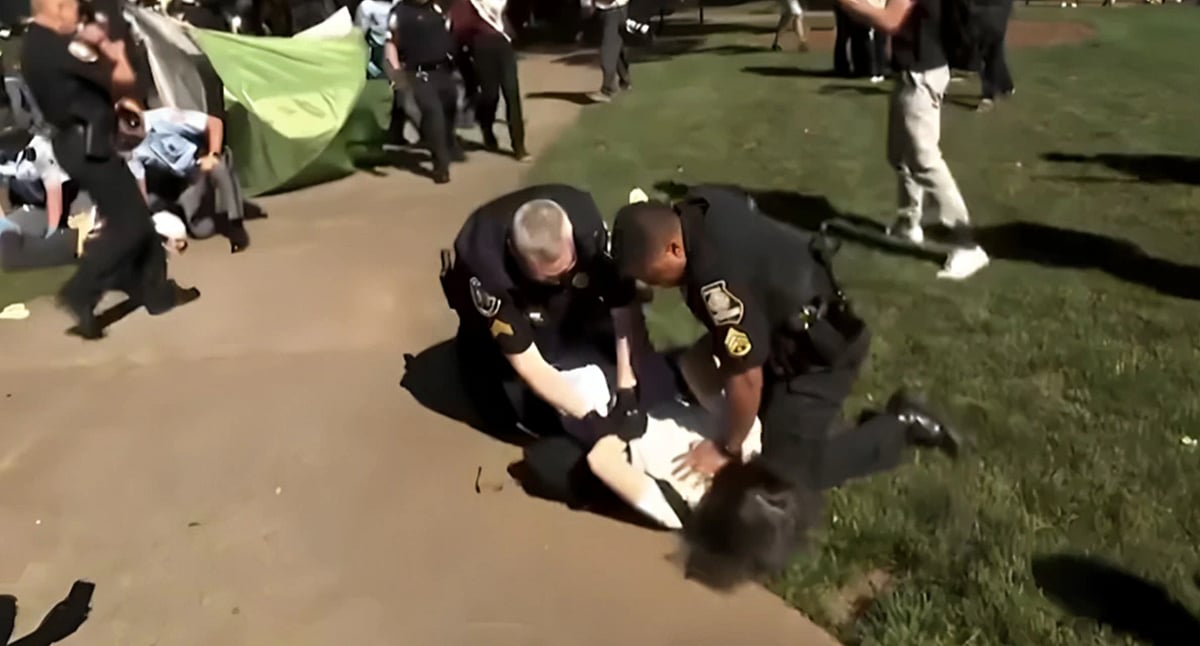 Screengrab : Professor Fohlin forcefully pushed to the ground by an officer. 