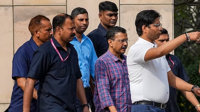 PTI : Arvind Kejriwal with ED officials at  Rouse Avenue court in Delhi |
