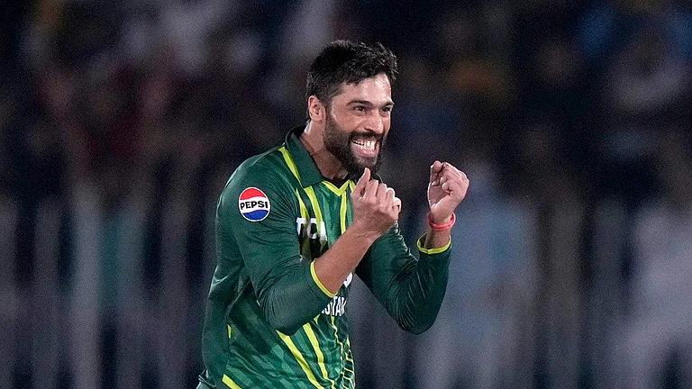 Pakistan's Mohammad Amir celebrates after taking the wicket of New Zealand's Dean Foxcroft during the second T20I in Rawalpindi on April 20, 2024. - AP/Anjum Naveed