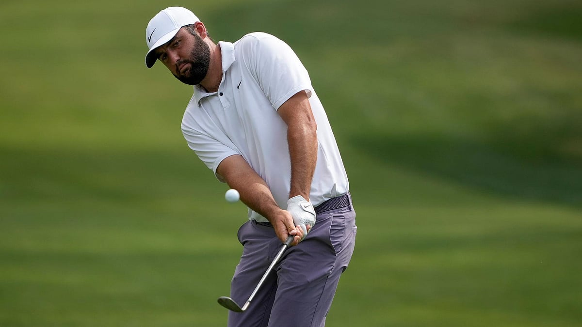 hris Carlson/AP : Scottie Scheffler chips to the green on the 15th hole during the third round of the RBC Heritage golf tournament.