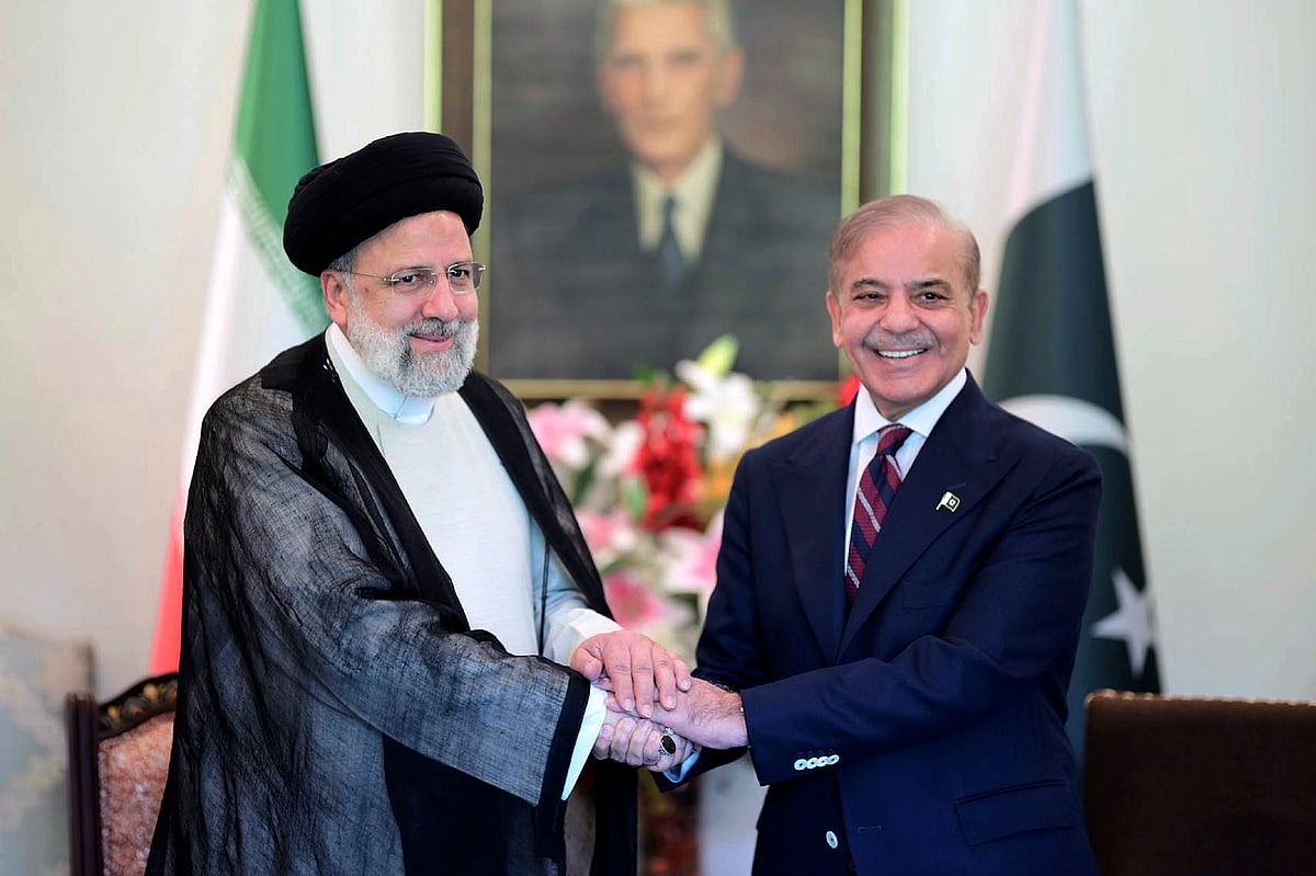 AP : Iranian President Ebrahim Raisi, left, shakes hand with Pakistan's Prime Minister Shehbaz Sharif prior to their meeting at prime minister house in Islamabad, Pakistan, Monday, April 22, 2024. 