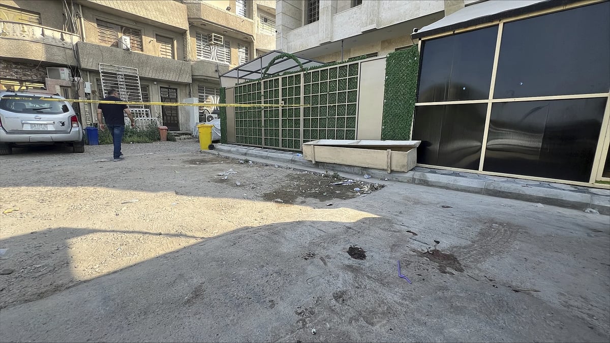 AP : Blood covers the ground at the scene of a shooting in Iraq's Baghdad |
