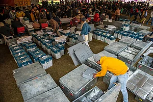Getty Images : Polling officials are seen distributing the Electronic Voting machines (EVM) and voter-verified paper audit trail (VVPAT) Ghaziabad