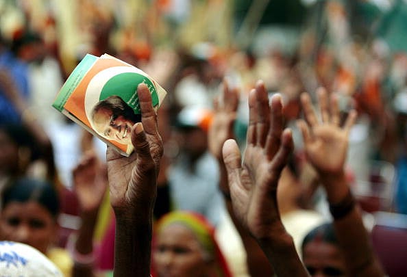 The India Today Group : Supporters take part in a support rally for Indian Minister for Science and Technology and Ocean Development Kapil Sabil before he leaves to file his election nomination papers in New Delhi on April 16, 2009.