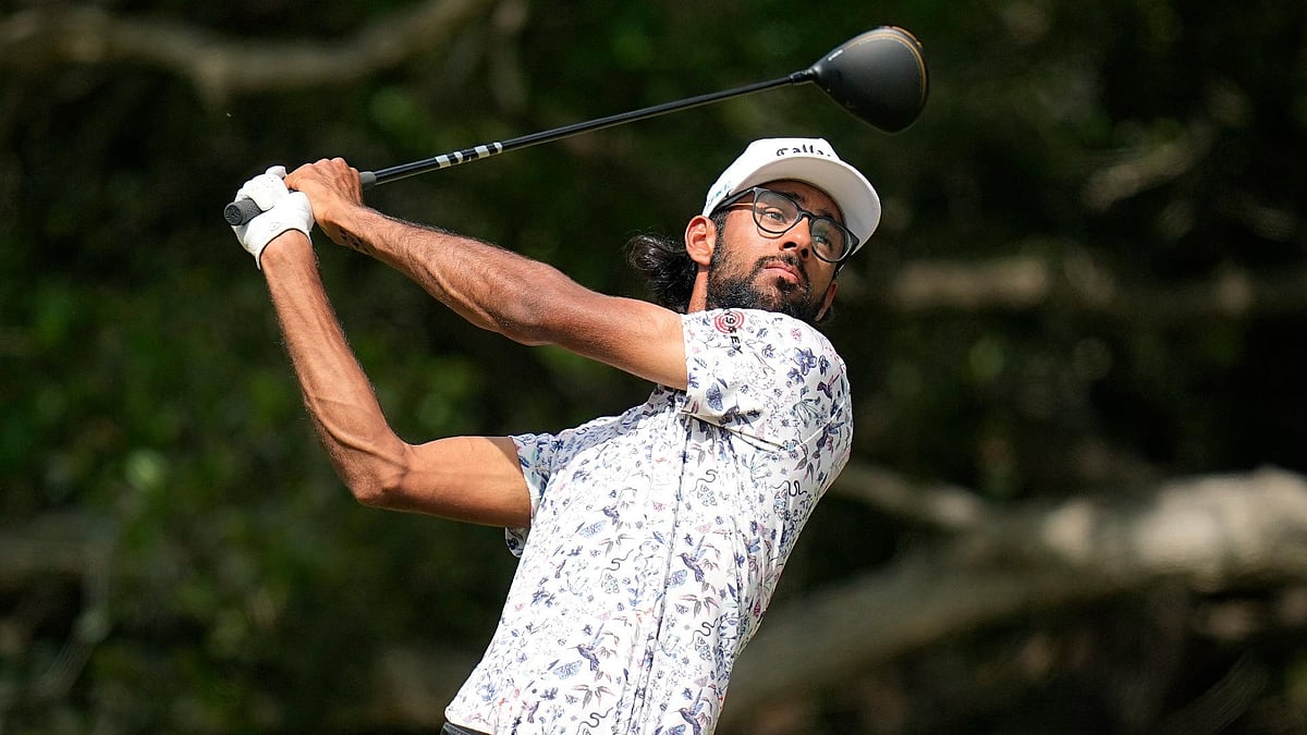Eric Gay/AP : Akshay Bhatia watches his tee shot on the 14th hole during the third round of the Texas Open golf tournament.