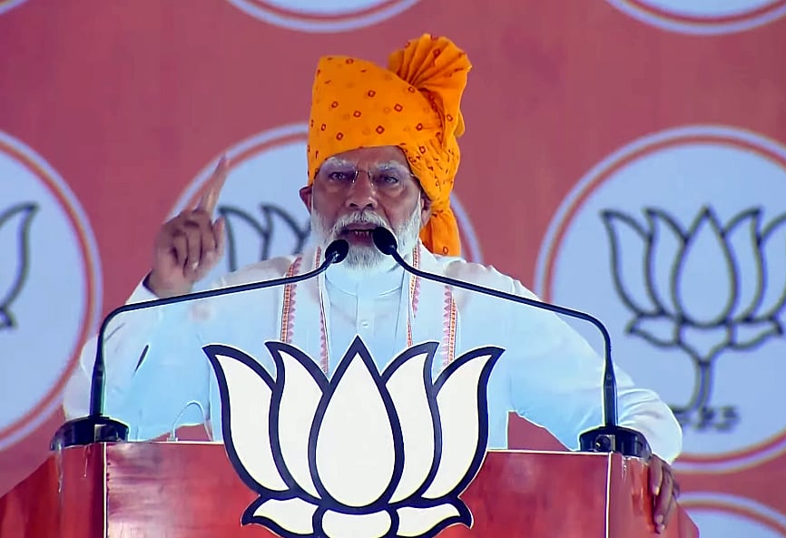 Prime Minister Narendra Modi addresses during a public meeting ahead of the second phase of Lok Sabha elections, in Banswara district.
