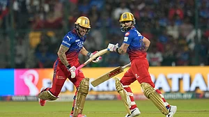 AP Photo/Aijaz Rahi : Royal Challengers Bengaluru's captain Faf du Plessis, left, and Virat Kohli run between the wickets to score a boundary during the Indian Premier League 2024 match between Royal Challengers Bengaluru and Kolkata Knight Riders in Bengaluru.