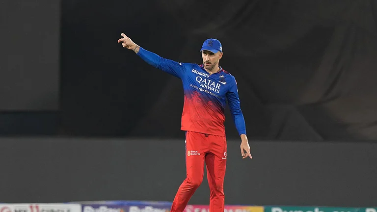 Royal Challengers Bengaluru's captain Faf du Plessis arranges the field during the Indian Premier League cricket match between Royal Challengers Bengaluru and Sunrisers Hyderabad in Hyderabad. - AP Photo/Mahesh Kumar A.