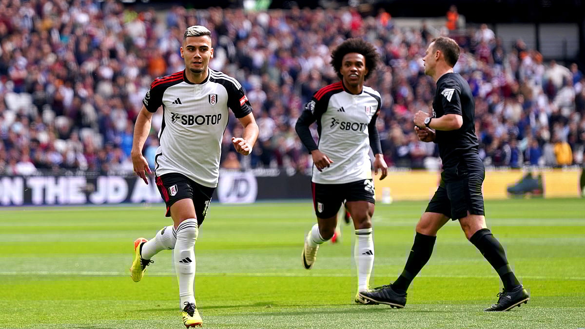 Fulham's Andreas Pereira, left, celebrates a goal against West Ham United during their English Premier League match at the London Stadium, London on April 14, 2024. - Bradley Collyer/PA via AP
