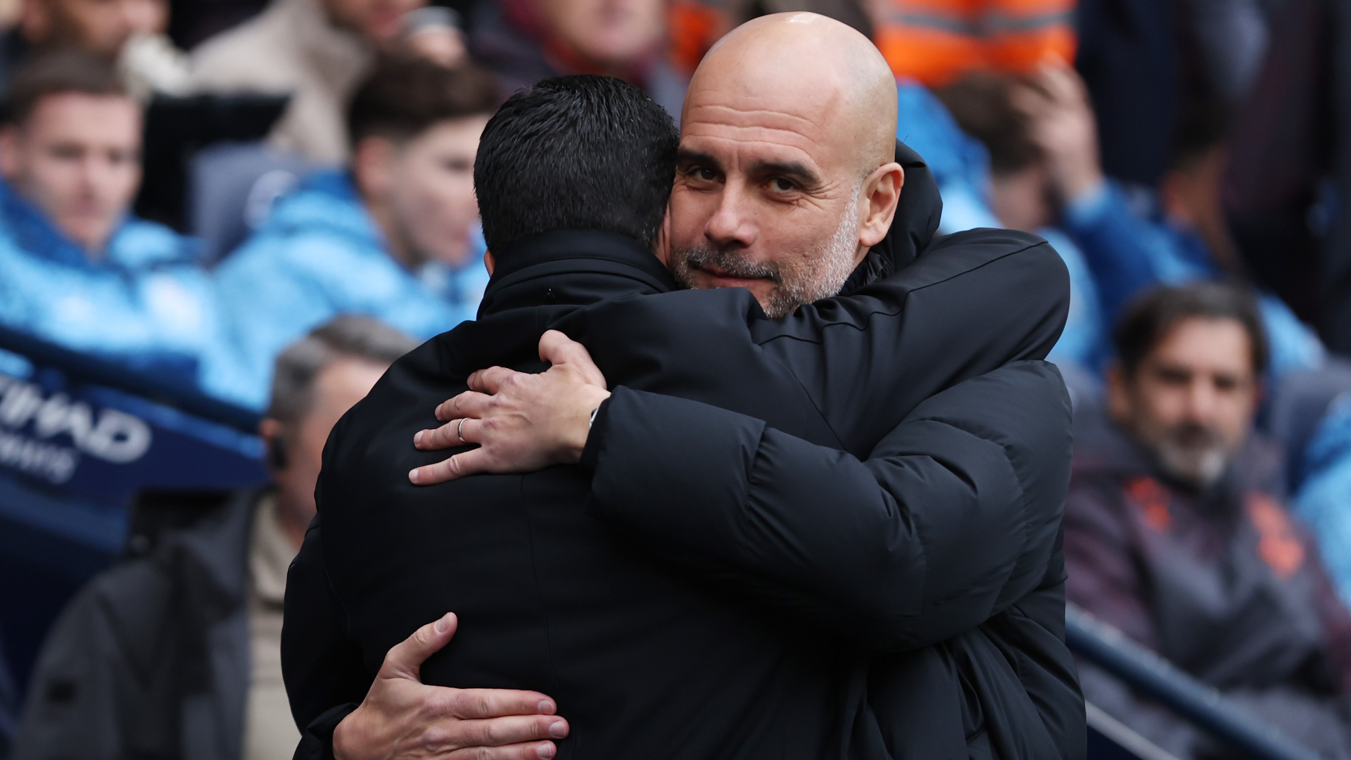 Pep Guardiola (R) shares an embrace with Arsenal's Mikel Arteta after Manchester City's goalless draw. - null