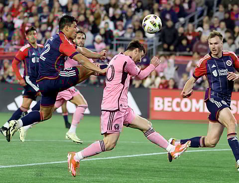 Lionel Messi (centre) in action during Inter Miami's Major League Soccer game against New England Revolution in Foxborough, Mass.
