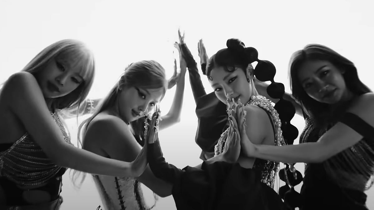 YouTube : A still of KISS OF LIFE members from 'Midas Touch'