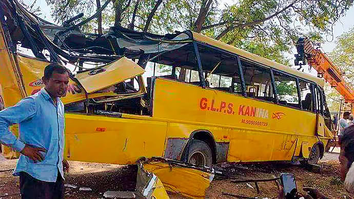 PTI : The mangled school bus belonging to GL Public School after the accident |