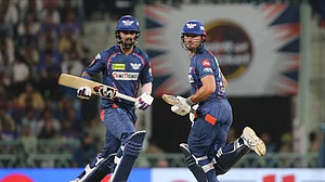 AP Photo/Surjeet Yadav : Lucknow Super Giants' Marcus Stoinis and KL Rahul run between the wickets during the Indian Premier League cricket match between Gujarat Titans and Lucknow Super Giants in Lucknow.