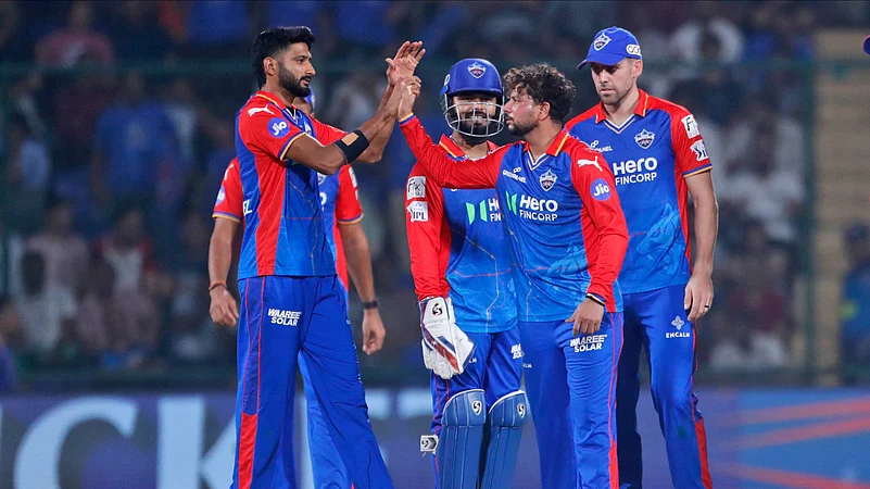 Delhi Capitals team celebrating a wicket in DC Vs GT match in IPL 2024. AP Photo