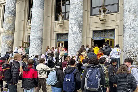 Students who walked out of Juneau-Douglas High School: Yadaa.at Kalé to protest Gov. Mike Dunleavy's veto of an education package enter the state Capitol.
