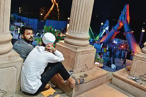 Two men seated at NaMo Ghat, Varanasi