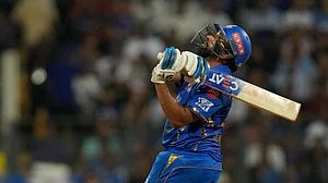 (AP Photo/Rajanish Kakade) : Mumbai Indians' Rohit Sharma plays a shot during the Indian Premier League cricket match between Mumbai Indians and Royal Challengers Bengaluru, in Mumbai, India, Thursday, April 11, 2024.