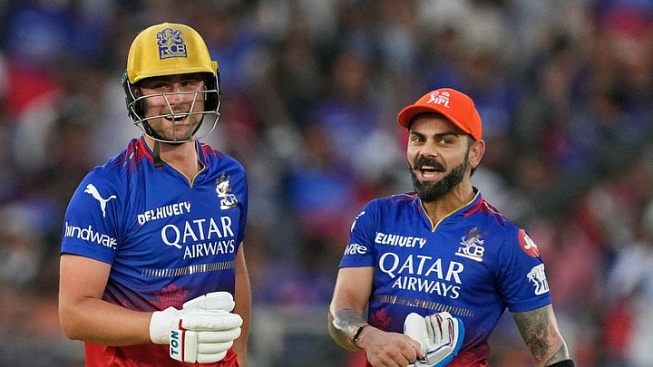 AP/Ajit Solanki : Royal Challengers Bengaluru's Will Jacks and teammate Virat Kohli, right, celebrate their team's victory in the Indian Premier League cricket match between Gujarat Titans and Royal Challengers Bengaluru in Ahmedabad