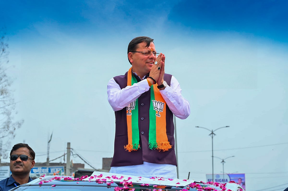 PTI Photo : Uttarakhand Chief Minister Pushkar Singh Dhami during an election campaign roadshow at Khatima 