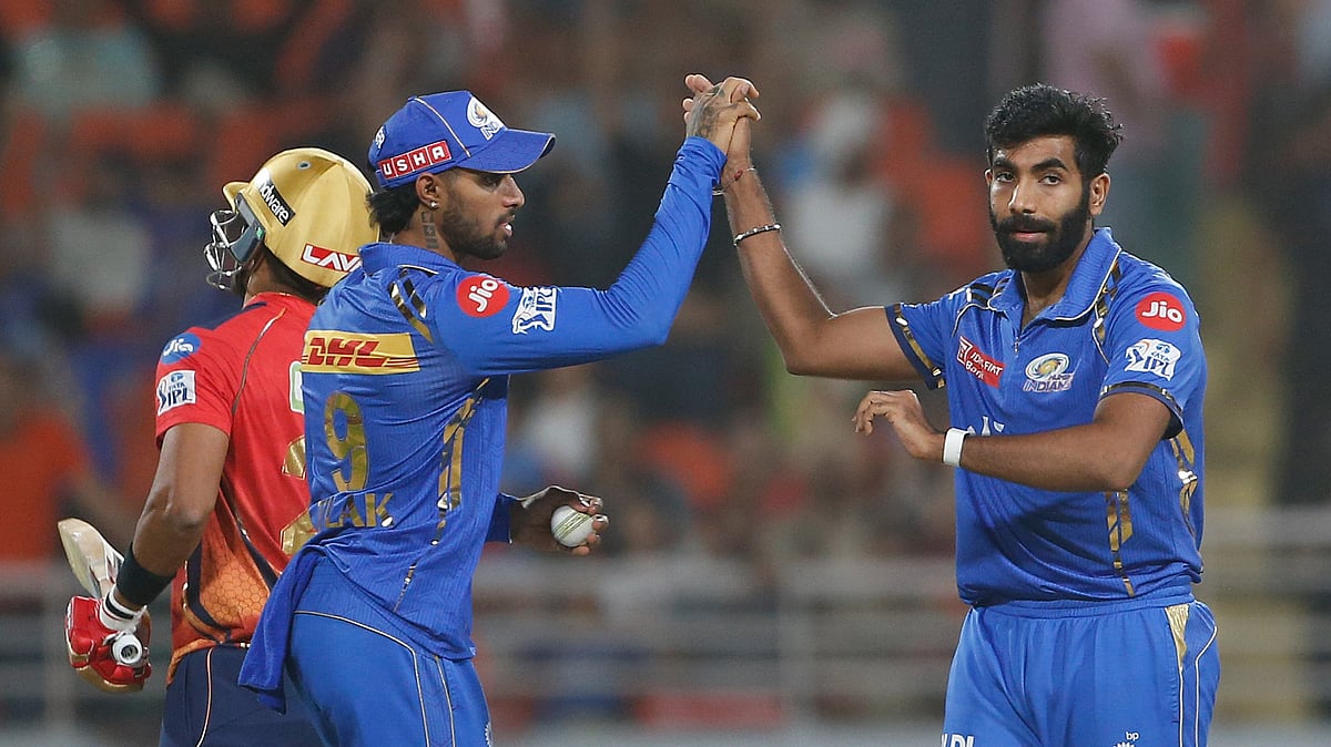 AP Photo/ Surjeet Yadav : Mumbai Indians' Jasprit Bumrah, right, and Mumbai Indians' Tilak Varma celebrate the dismissal of Punjab Kings' Shashank Singh during the Indian Premier League cricket match between Punjab Kings' and Mumbai Indians in Mullanpur.