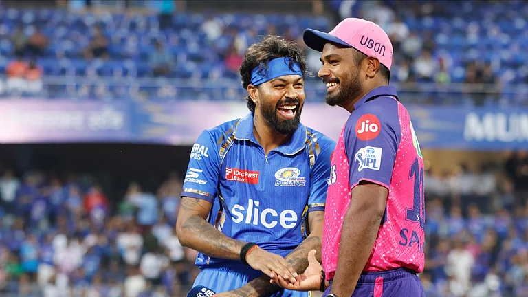Mumbai Indians captain Hardik Pandya (L) with Rajasthan Royals skipper Sanju Samson at toss time in IPL 2024. - X/ @IPL