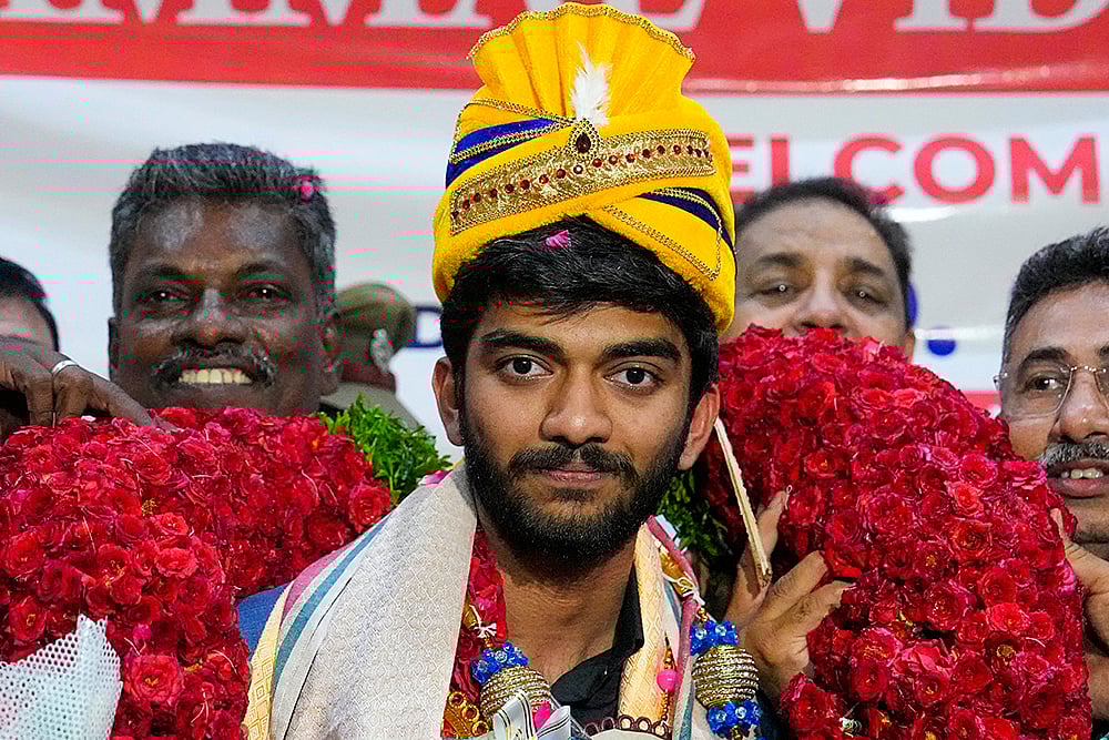 | Photo: PTI/R Senthilkumar : Grandmaster Gukesh at Chennai Airport