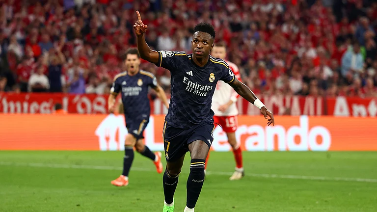 Vinicius Junior celebrates his second goal against Bayern Munich on Tuesday - null