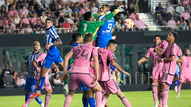 Inter Miami goalkeeper Drake Callender (1) defends the goal against Monterrey forward German Berterame (9) during the second half of the first leg of a CONCACAF Champions Cup quarterfinal on Wednesday. - AP Photo/Lynne Sladky