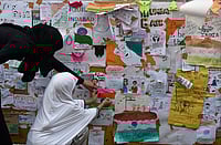 Hamraaz's Poetry Weaves Personal With Political  Getty Images : Students draw painting while Muslim women stage a Shaheen Bagh like protest against CAA and NRC at Mumbai central, on February 4, 2020 in Mumbai, India.
