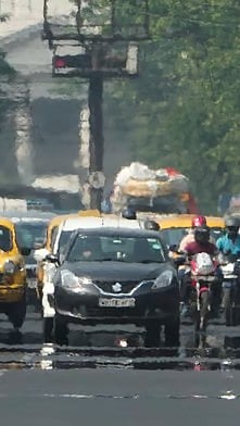 Mirage appears on the Red road on a hot Summer day, in Kolkata |
