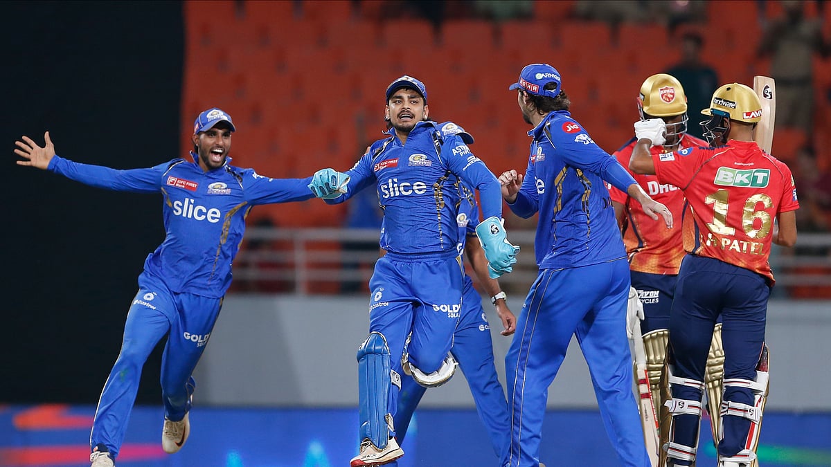 Mumbai Indians players celebrate their win against Punjab Kings' during the Indian Premier League cricket match between Punjab Kings' and Mumbai Indians in Mullanpur. - AP Photo/ Surjeet Yadav