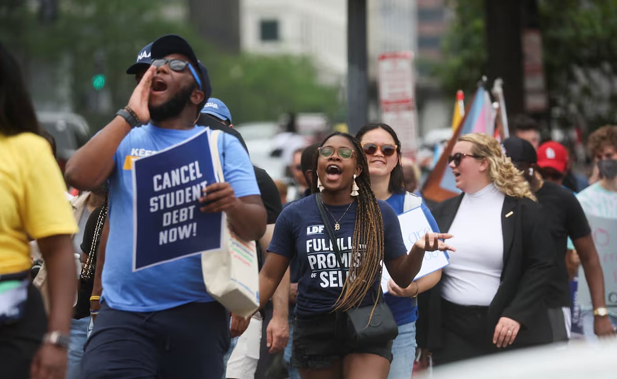 Supporters of US President Joe Biden's s plans for student debt relief march - Reuters