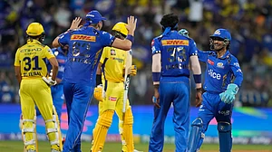 AP Photo/ Rafiq Maqbool : Mumbai Indians' Ishan Kishan, right, celebrates the dismissal of Chennai Super Kings' Rachin Ravindra during the Indian Premier League cricket match between Mumbai Indians and Chennai Super Kings in Mumbai.