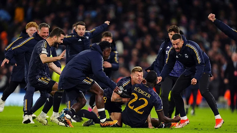 Real Madrid celebrate win over Manchester City in penalties, UEFA Champions League quarterfinals second leg, April 18, 2024, AP Photo