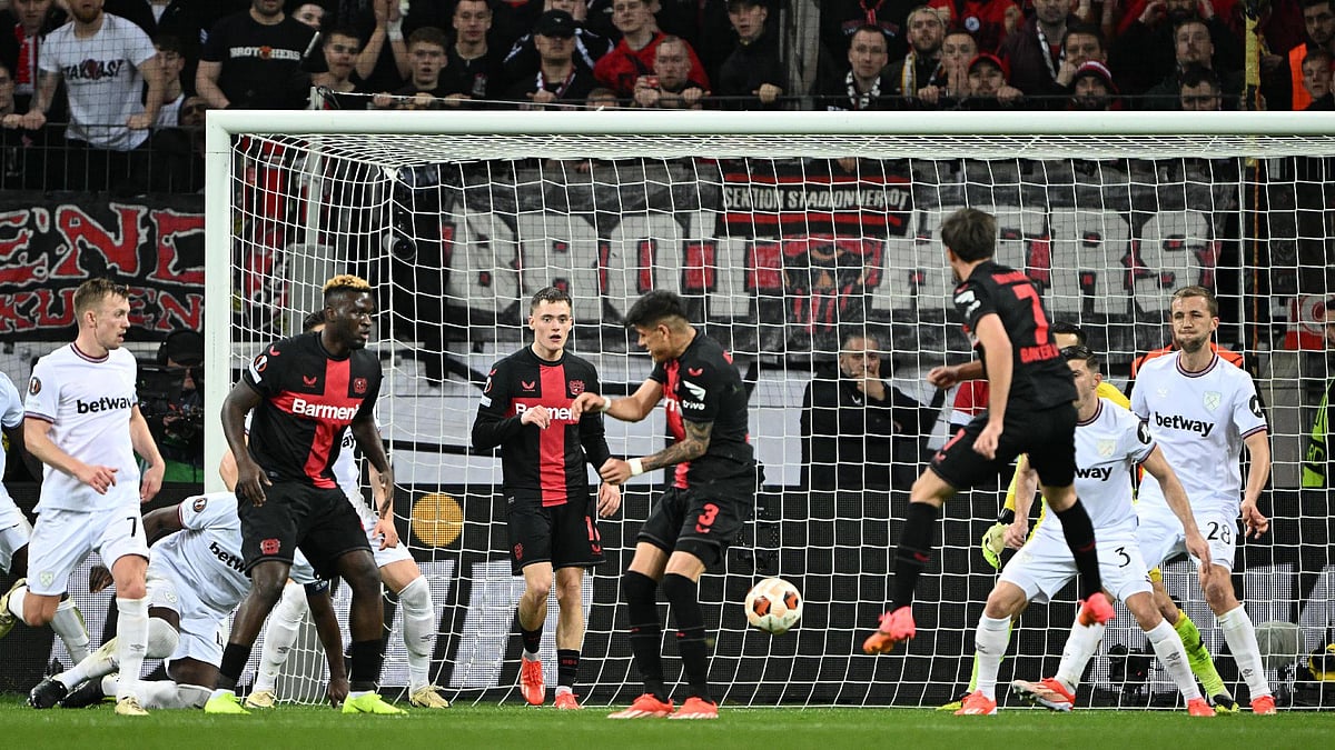 PA Wire via DPA/PA : Bayer Leverkusen’s Jonas Hofmann scores their first goal.