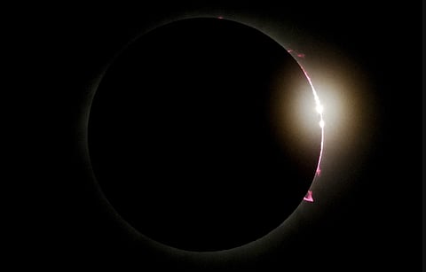 The moon partially covers the sun during a total solar eclipse, as seen from Mazatlan, Mexico.